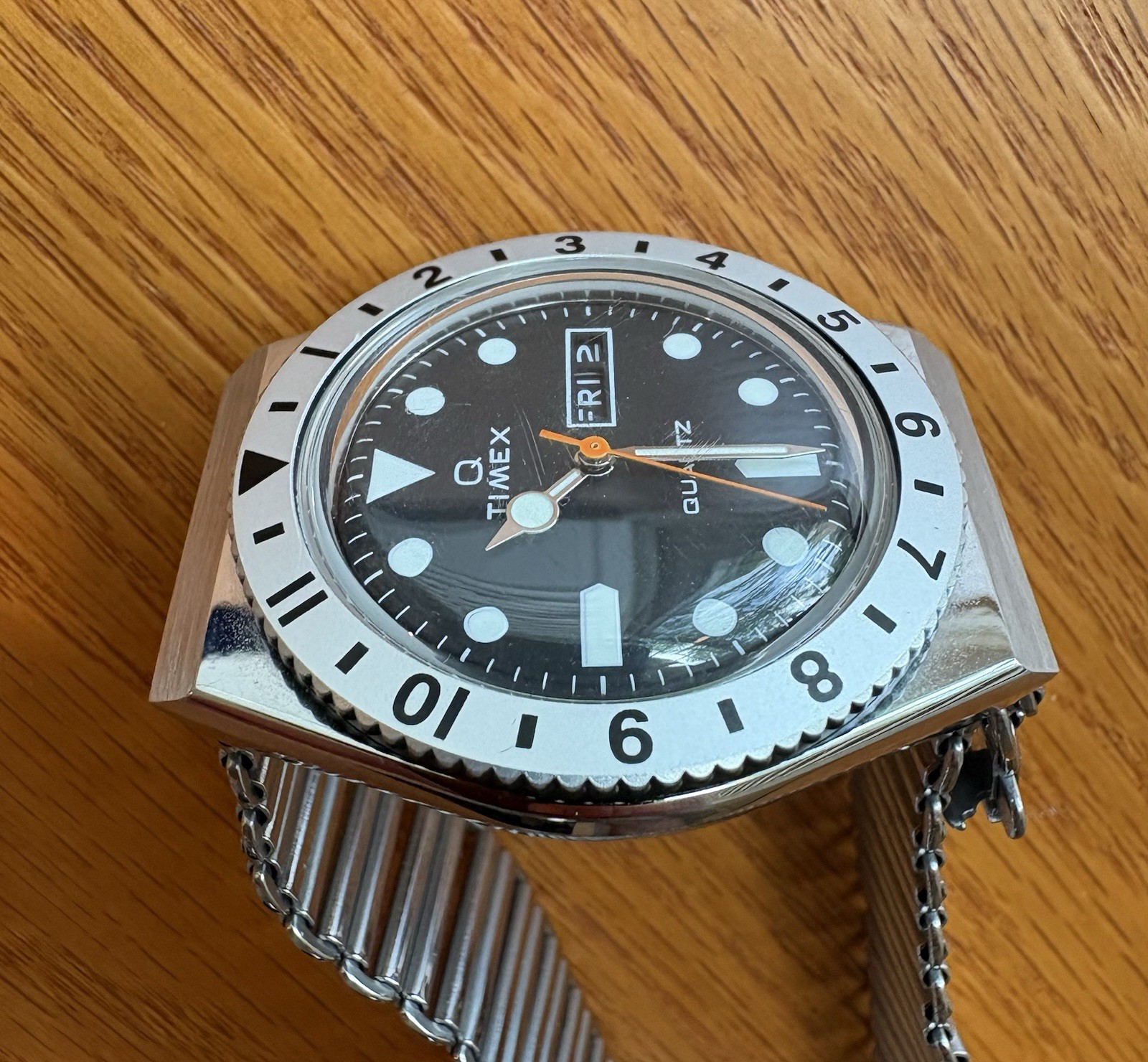 Timex Q Reissue, 12-hr dual-time bidirectional bezel, Bonklip-style bracelet.