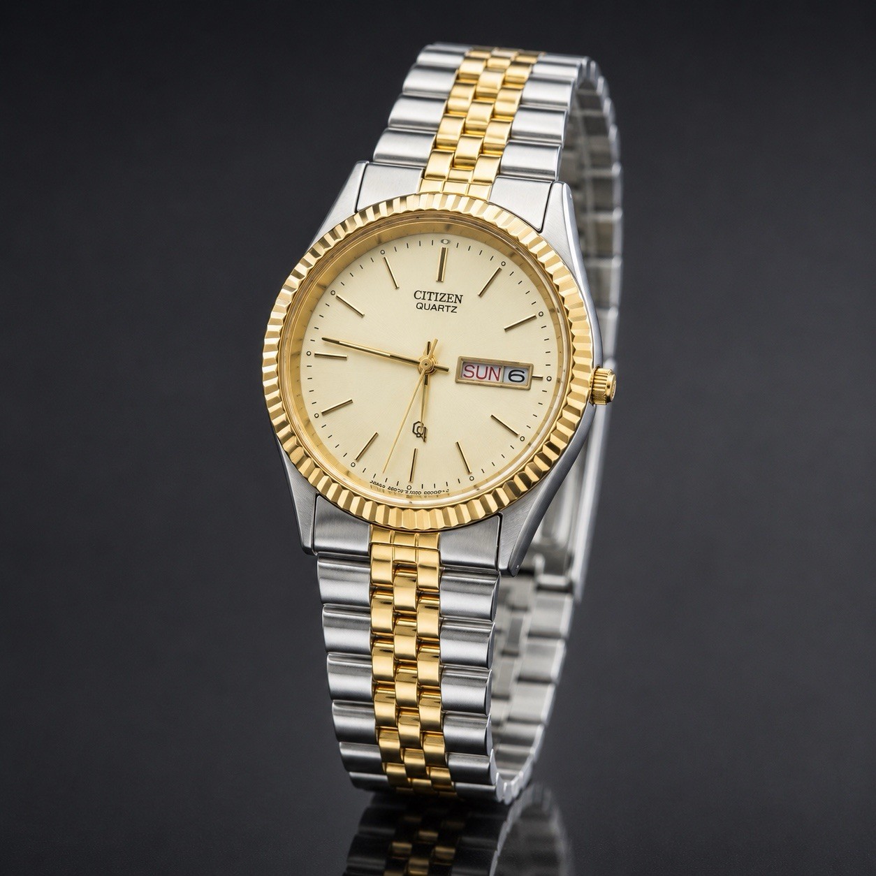 Citizen Quartz Men’s Two-Tone Stainless Bracelet Gold Dial Day/Date Watch.