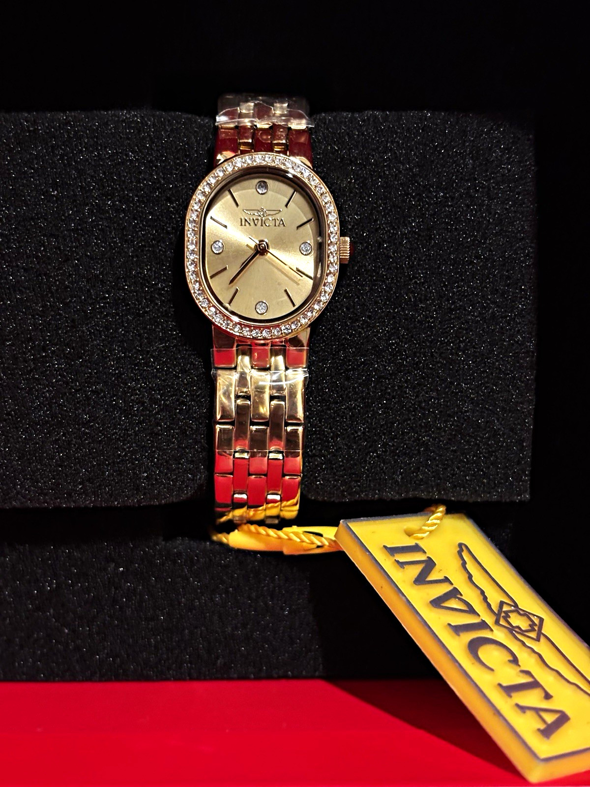 Invicta Women’s Gold-Tone Oval Quartz Analog Crystal Bezel Metal Bracelet