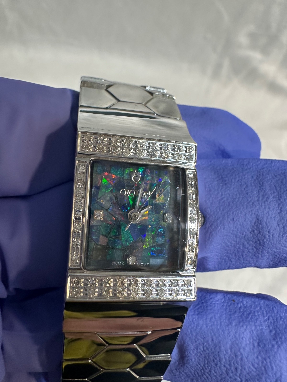 Women’s Croton mosaic opal dial and a diamond-encrusted bezel