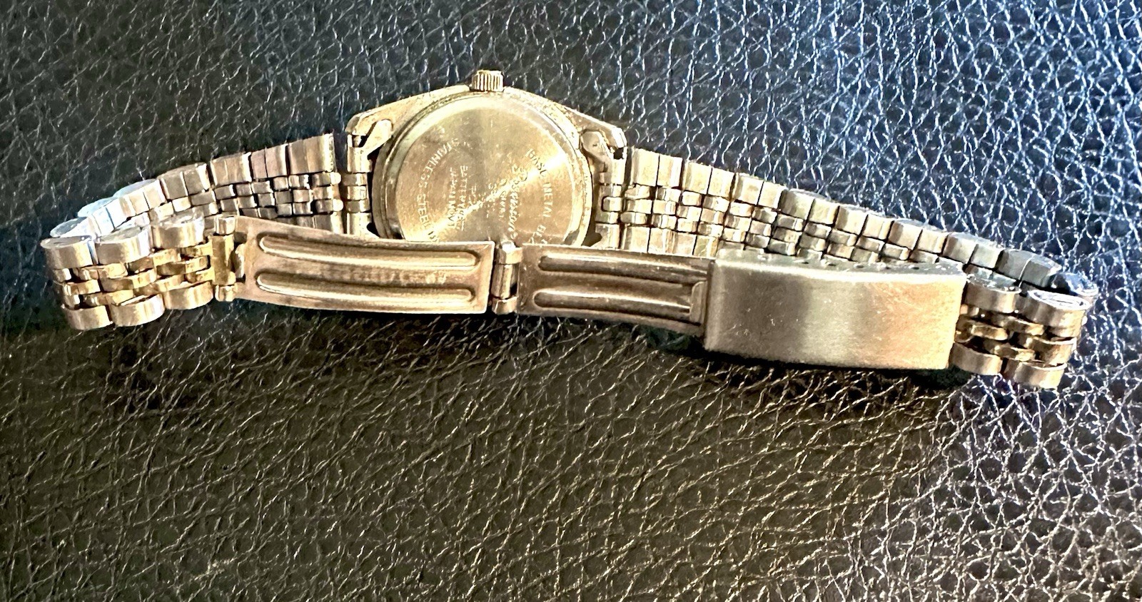 vintage Precision by Gruen quartz watch featuring a two-tone gold and silve
