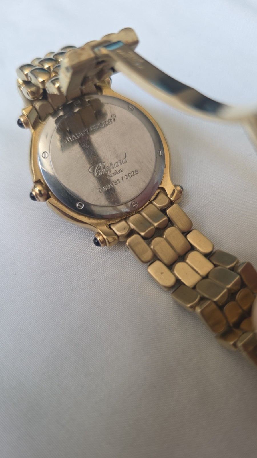 Gold Chopard Geneve black face happy sport watch