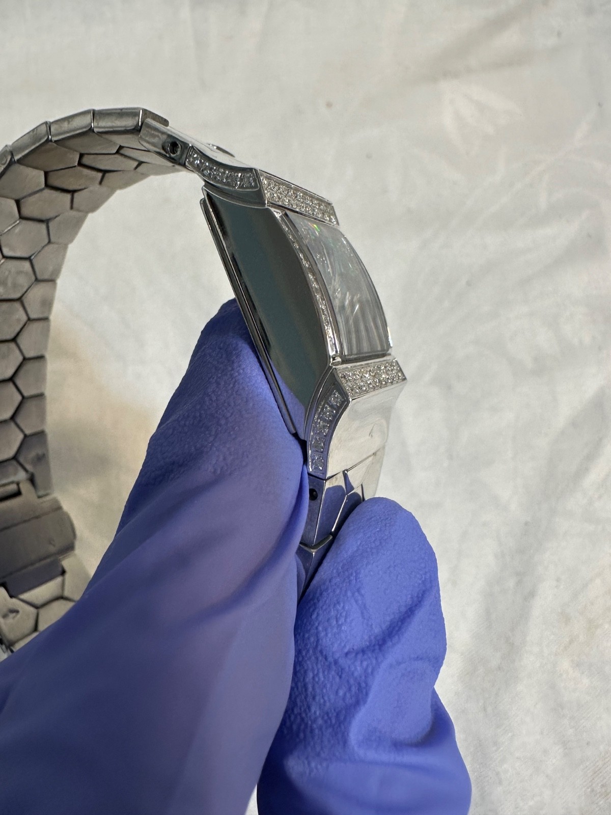 Women’s Croton mosaic opal dial and a diamond-encrusted bezel