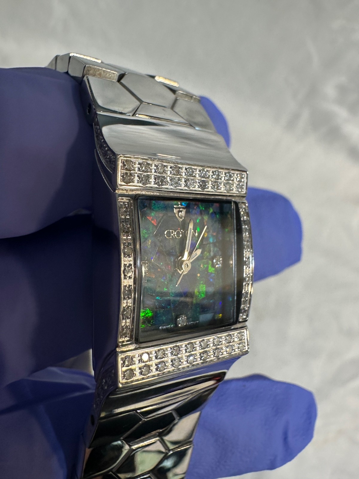 Women’s Croton mosaic opal dial and a diamond-encrusted bezel