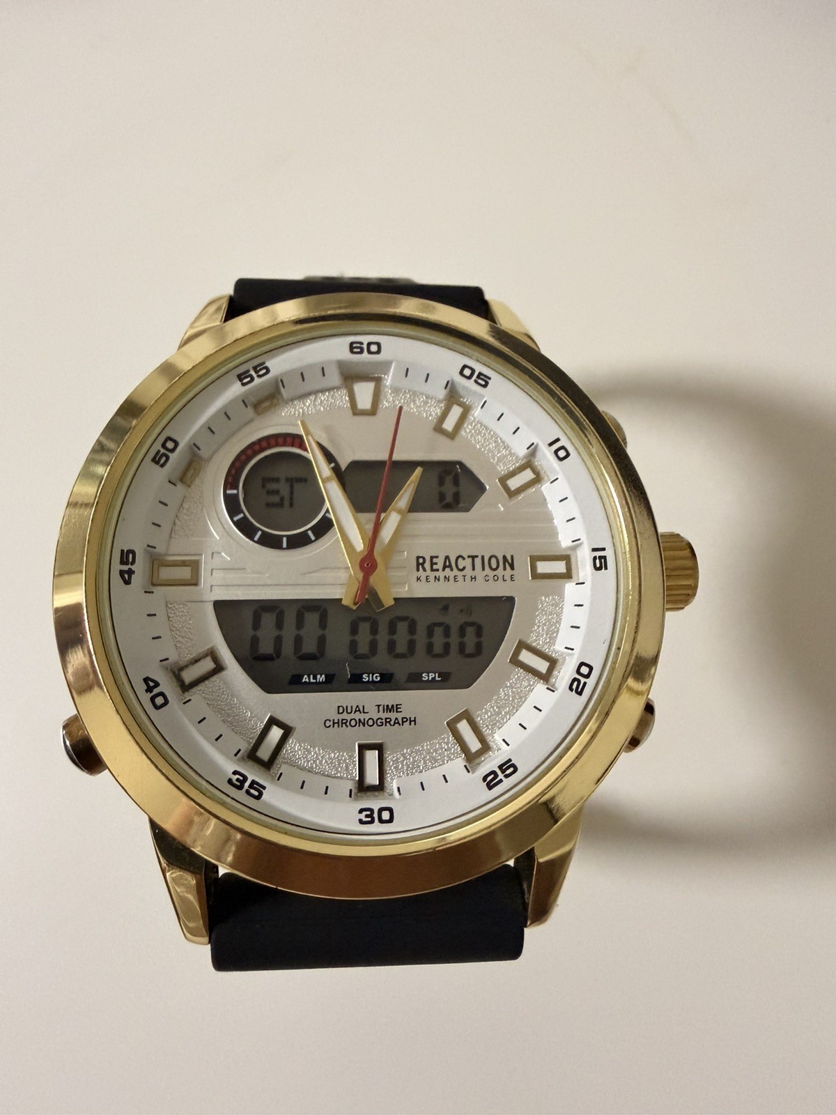 Kenneth Cole Reaction watch for menGold with black Silicone Band