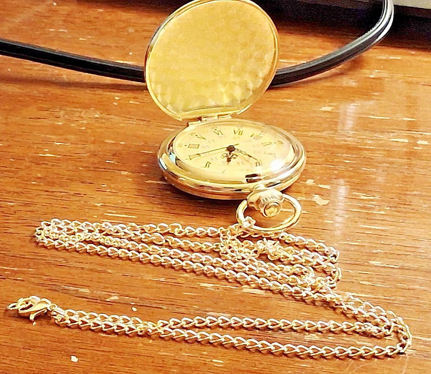 Gold tone comememorative pocket watch titled Anniversary We the People