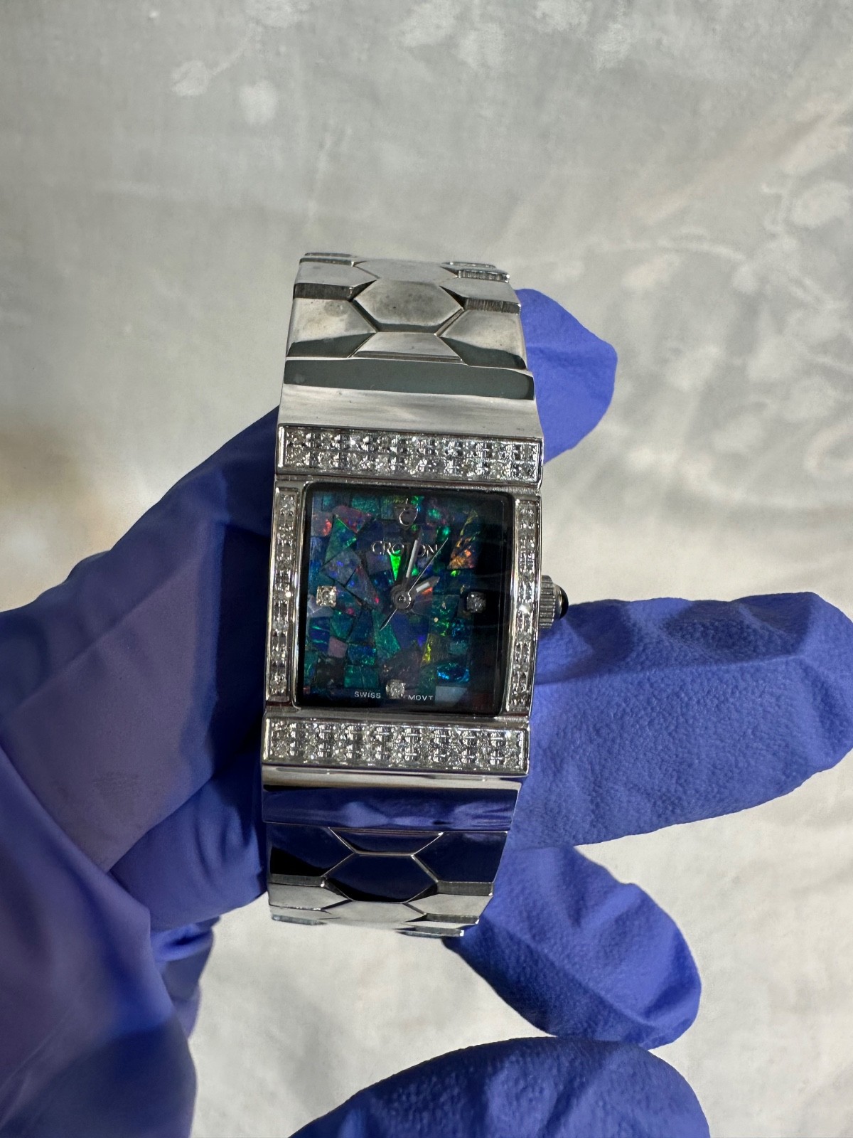 Women’s Croton mosaic opal dial and a diamond-encrusted bezel