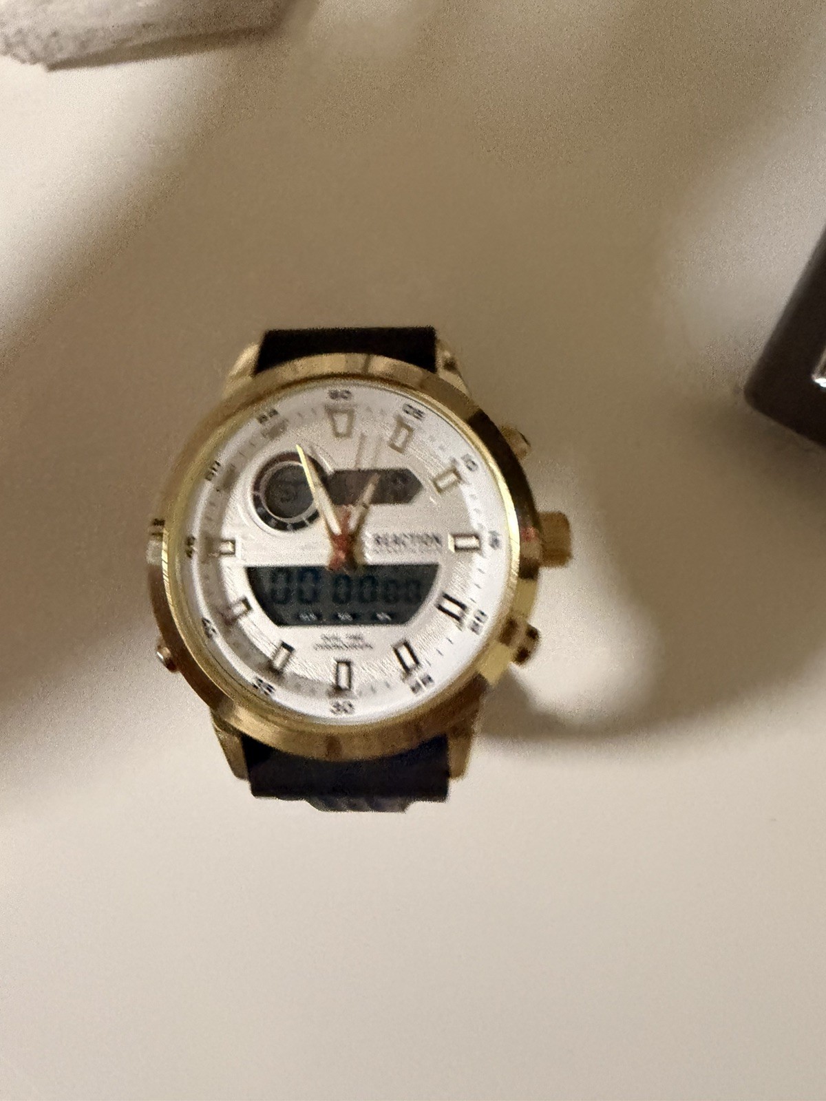 Kenneth Cole Reaction watch for menGold with black Silicone Band