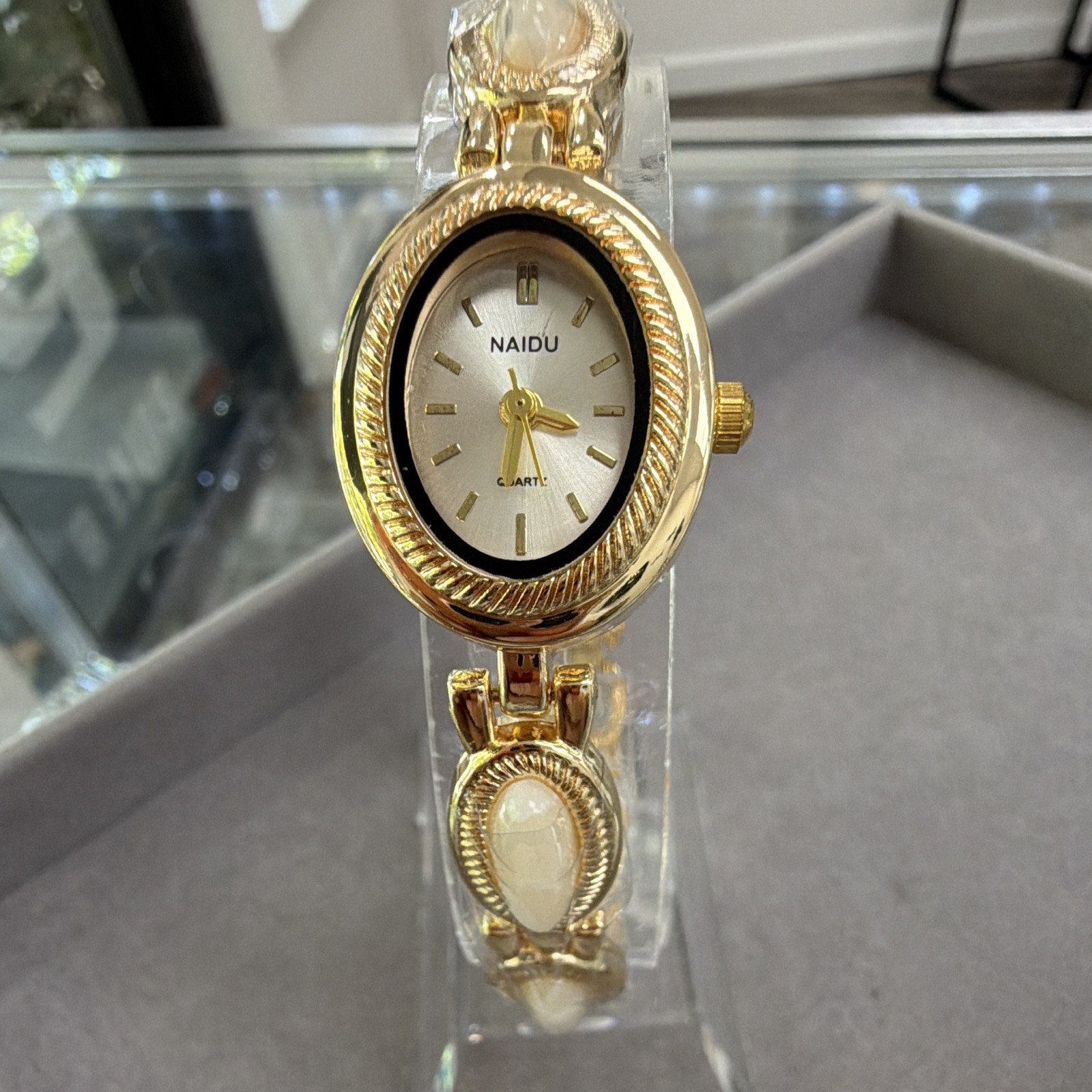 NAIDU Women’s Quartz Analog Oval Watch Gold Tone Bracelet White Dial