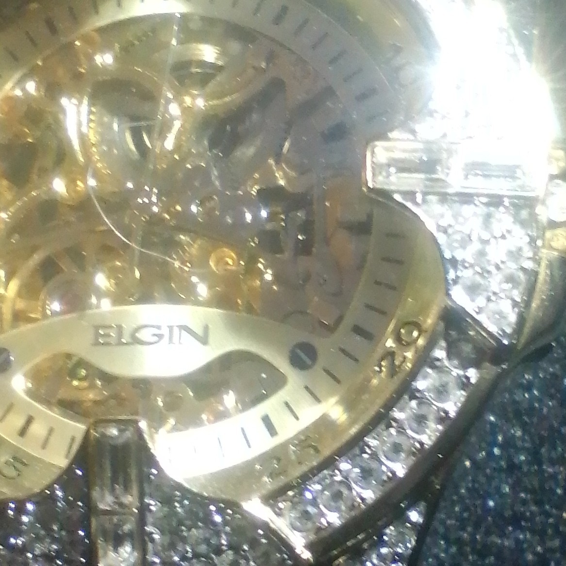 Elgin Women’s Analog Wristwatch Skeleton Dial Two-Tone Bracelet Gem-Set Bezel
