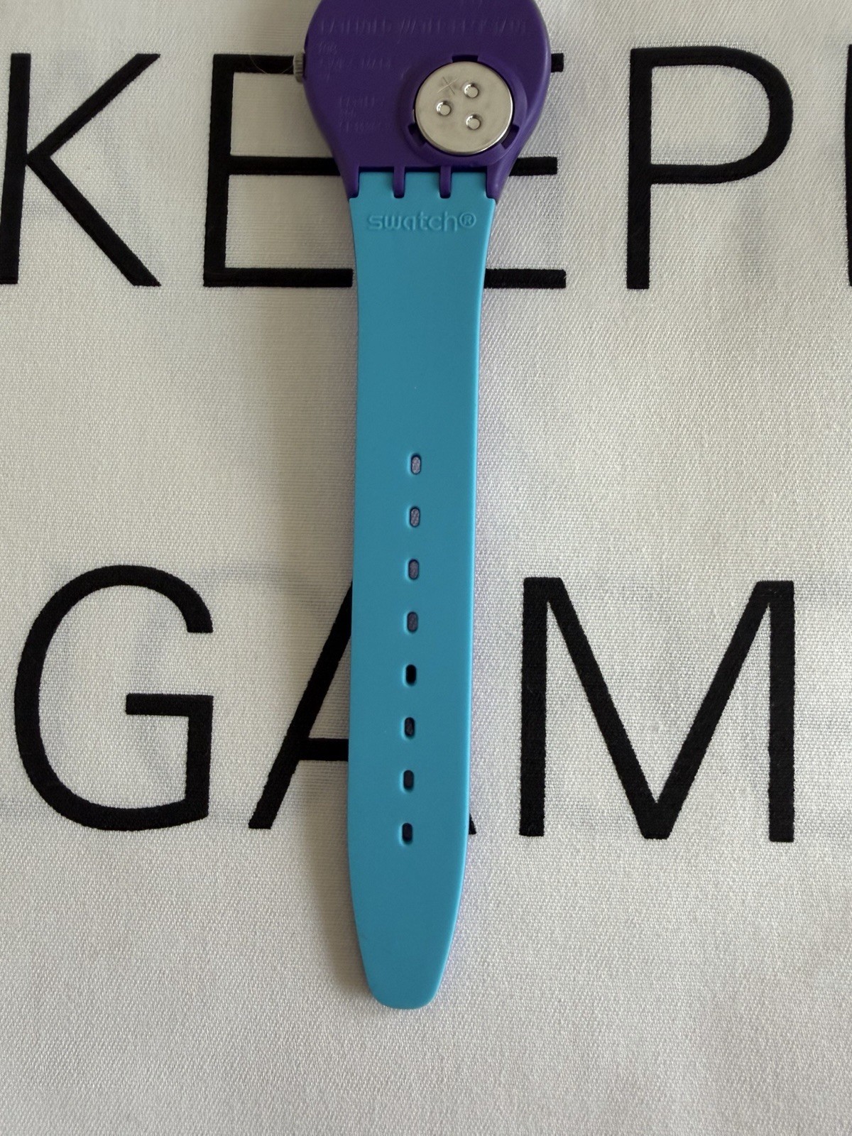Swatch GV128 Polymer Watch – Turquoise Dial& Purple Strap – New in Box
