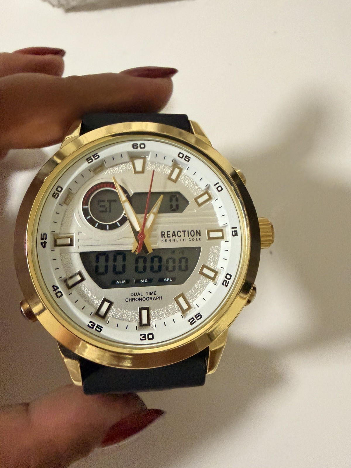 Kenneth Cole Reaction watch for menGold with black Silicone Band