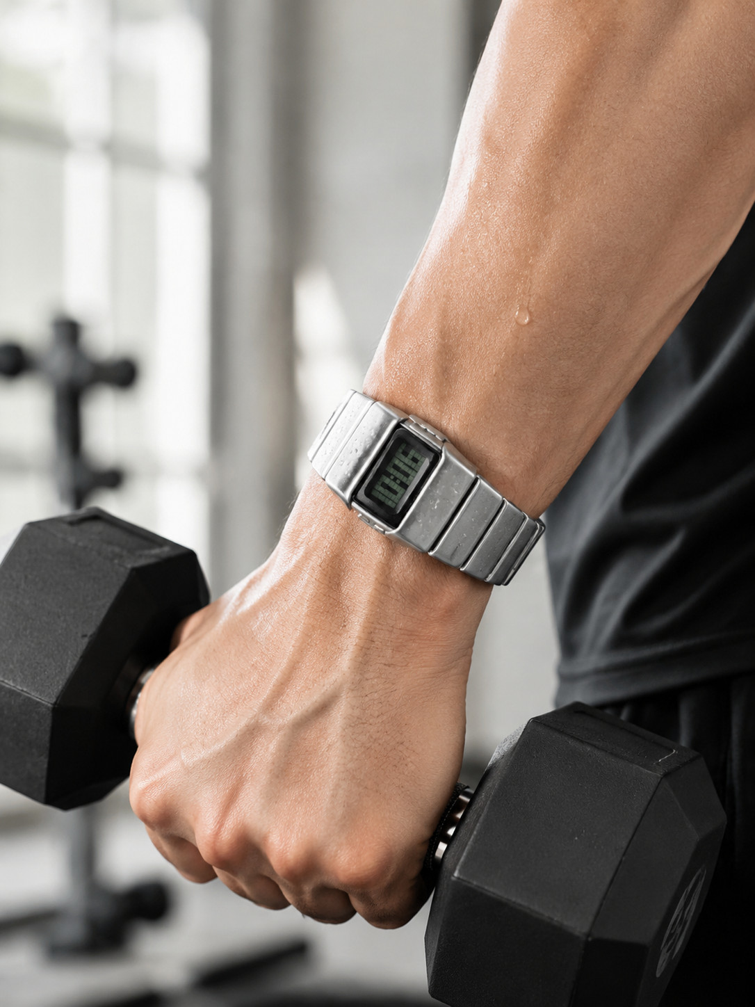 Sleek silver metal digital watch with retro futuristic style.