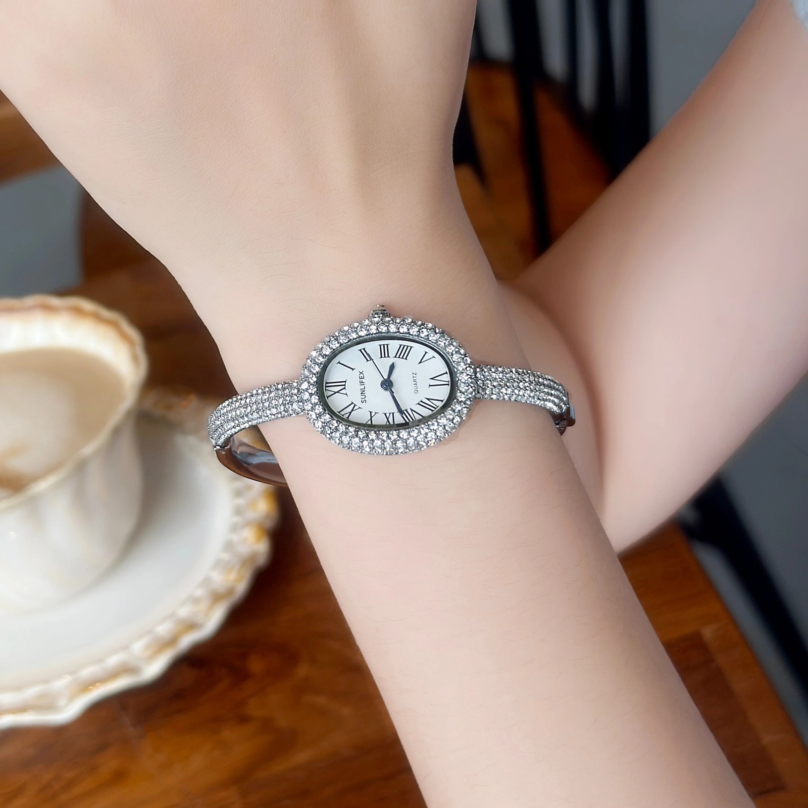 Luxury Crystal Oval Bangle Watch For Women Roman Numeral Dial Rhinestone Inlaid