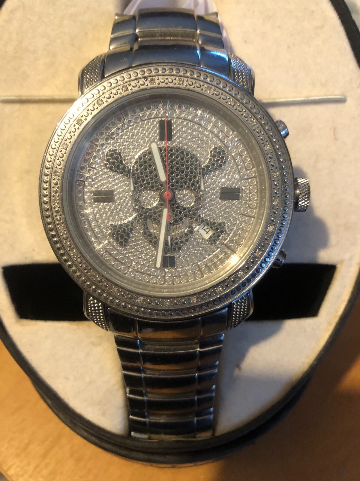 jojino skull face watch,new in box steel color. real diamonds.