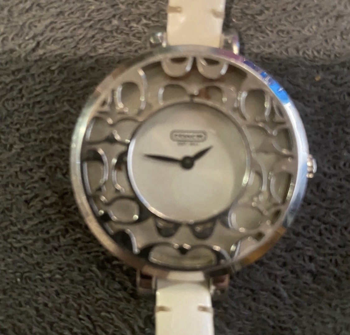 Coach ladies’ Sabrina 14501433 stainless steel silver quartz watch.
