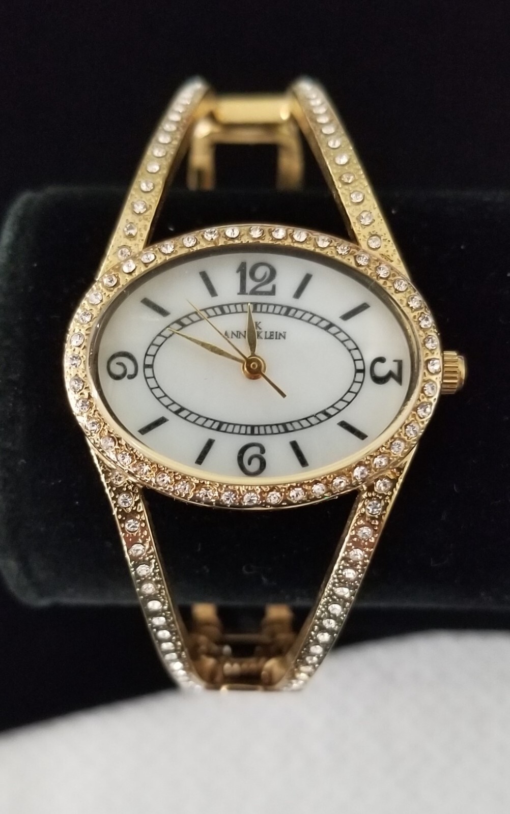 Anne Klein Gold Tone Cuff Watch 10/8216 MOP Crystal Bezel 6.5″ Closed New Batt.