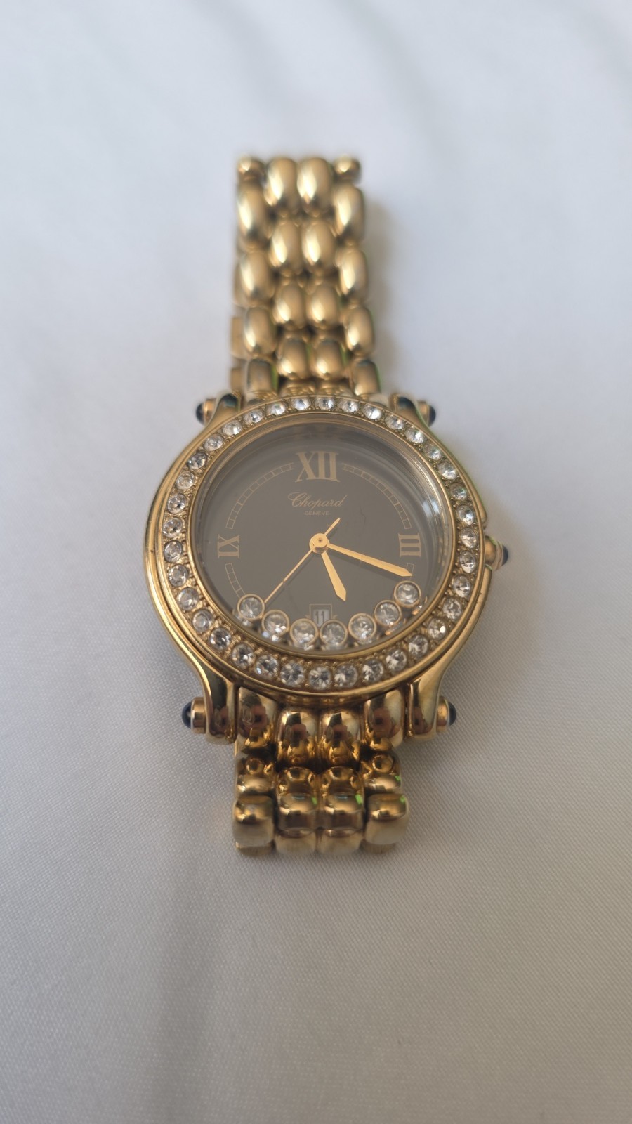 Gold Chopard Geneve black face happy sport watch