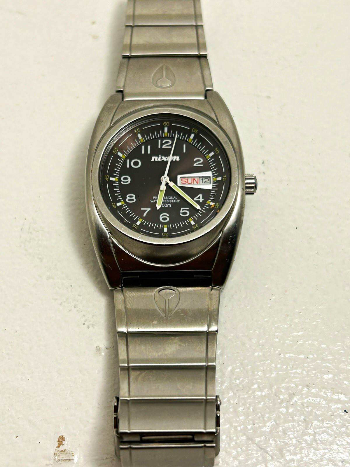 Nixon Quartz Wristwatch Black Dial Day/Date 100m Silver Stainless Bracelet