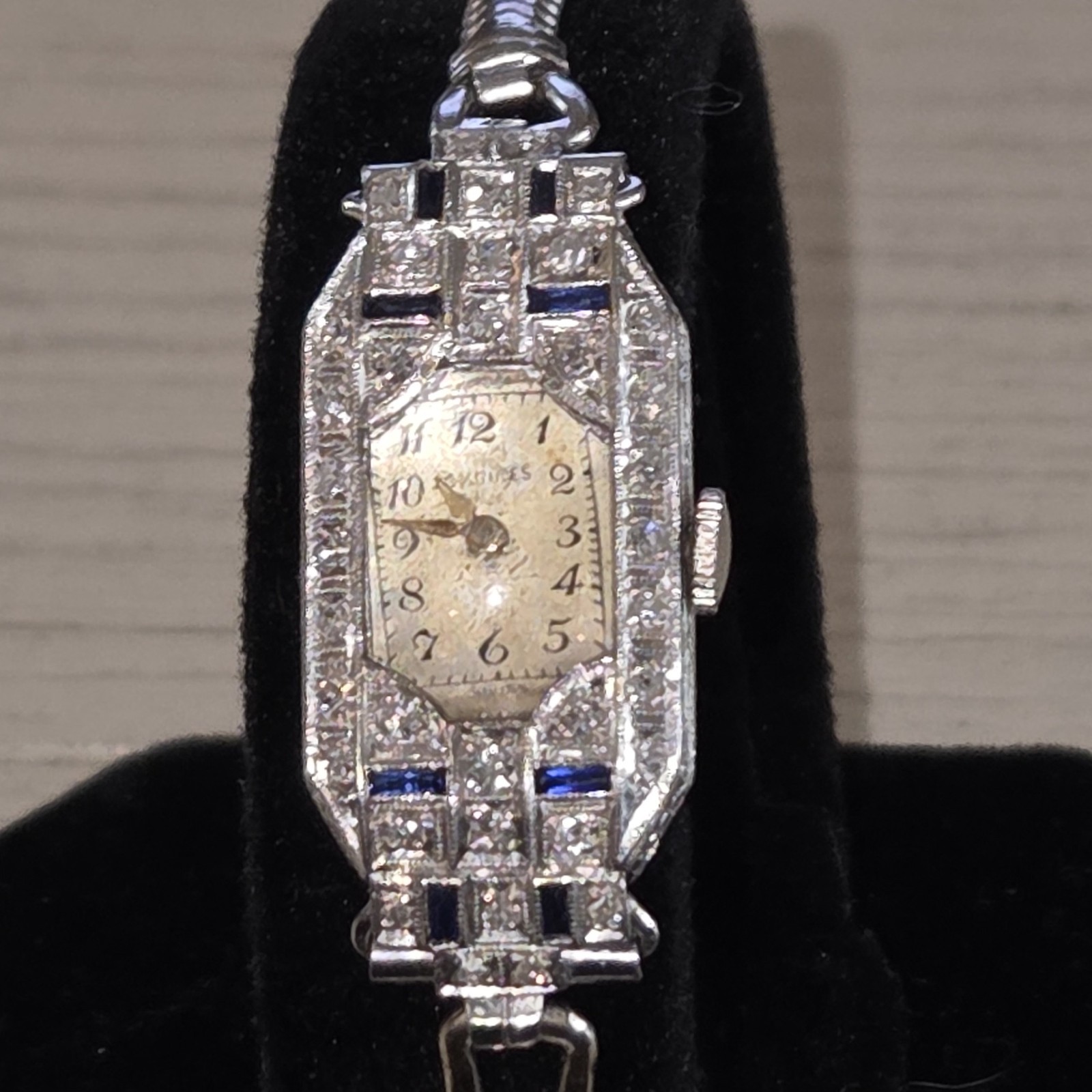 vintage watch, Art Deco style, tiny diamonds and small sapphire bars adorn the f