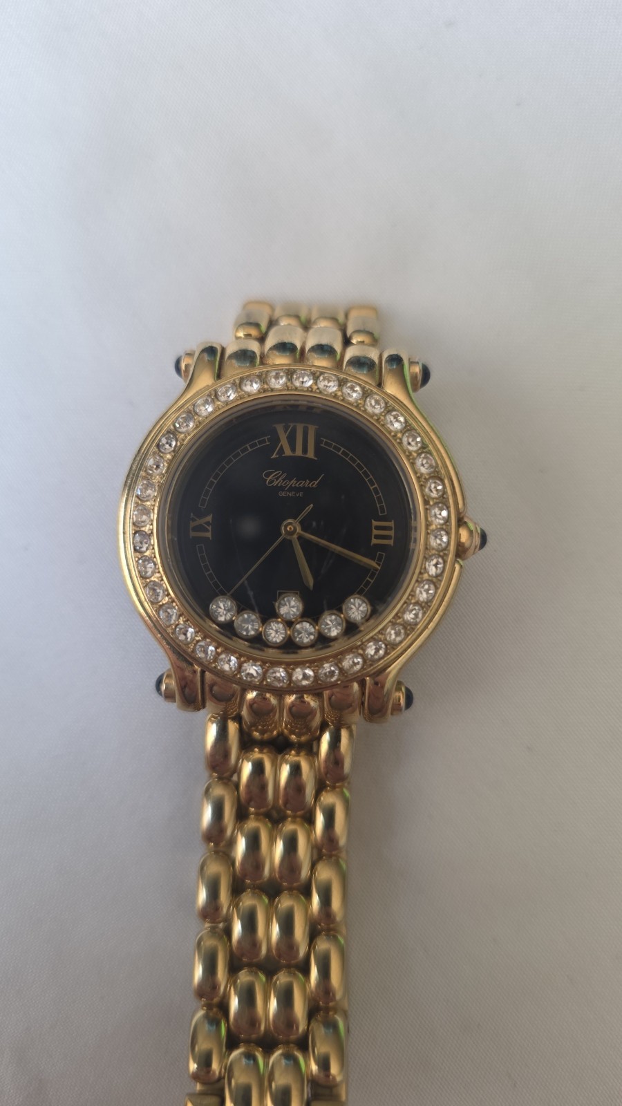 Gold Chopard Geneve black face happy sport watch