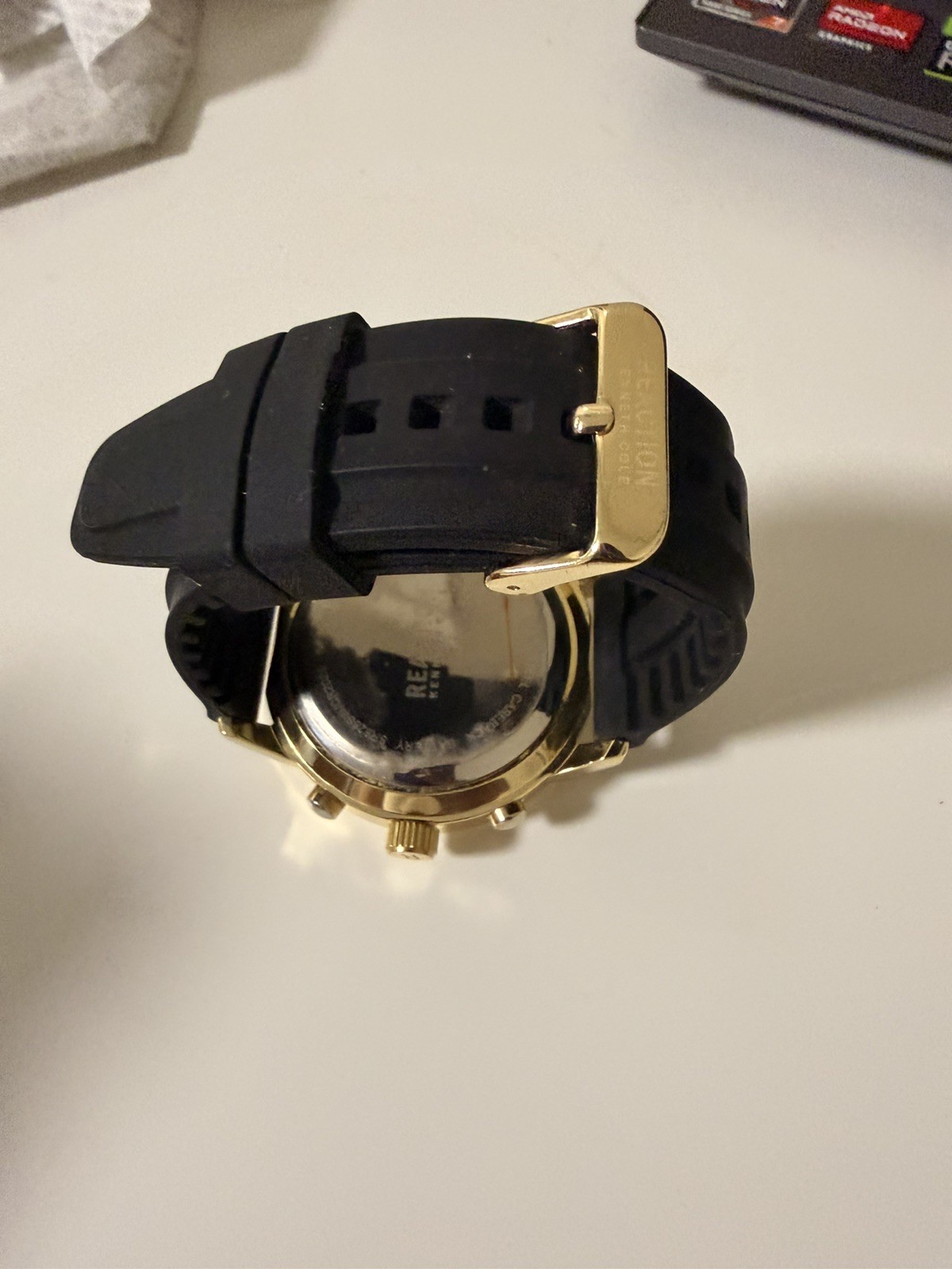 Kenneth Cole Reaction watch for menGold with black Silicone Band