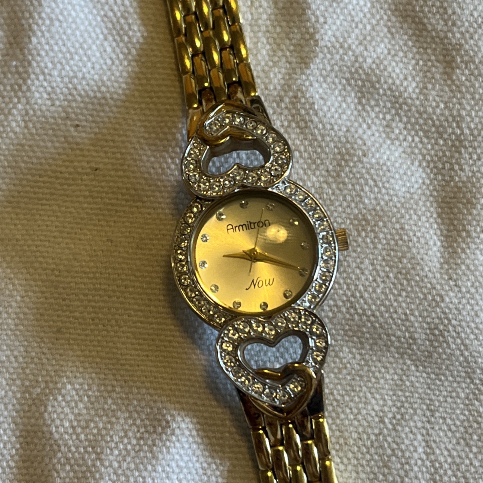 Armitron “Now” Gold-Tone Bracelet Watch – Rhinestone Hearts Accent