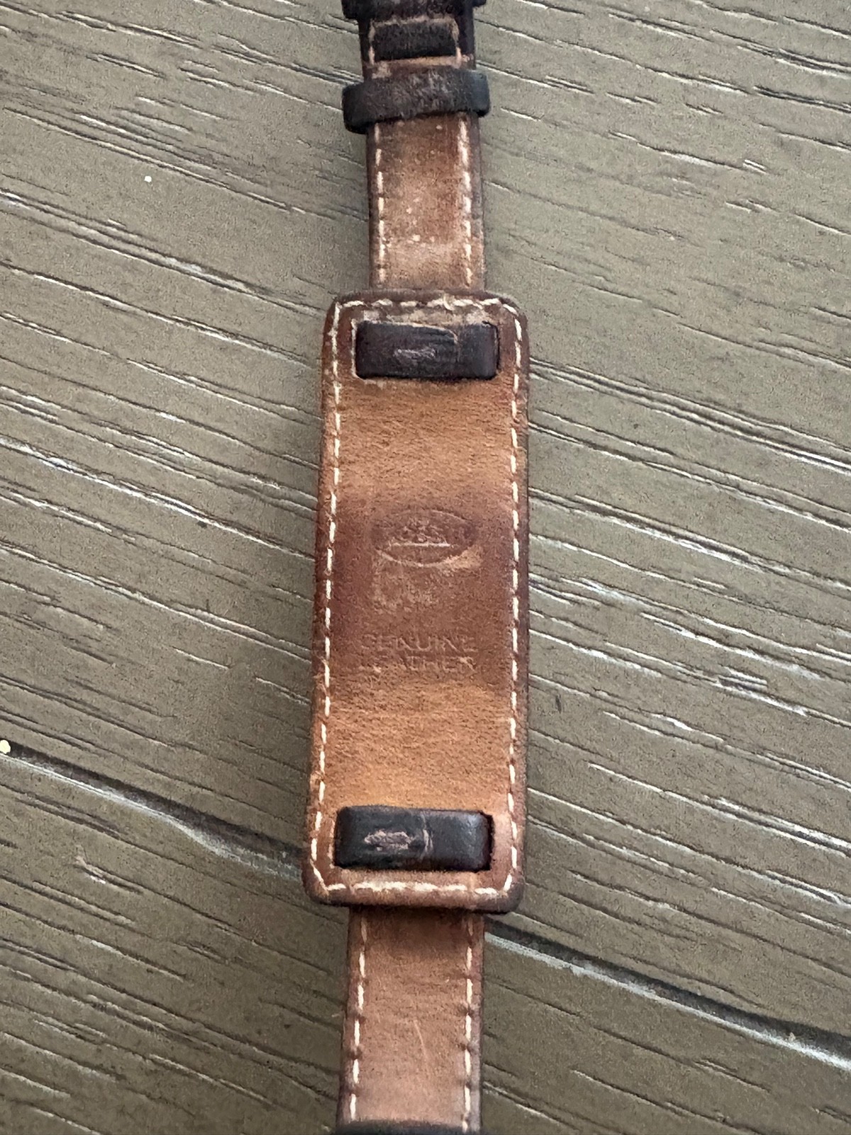 womens vintage fossil watch with silver rectangular face and brown leather strap