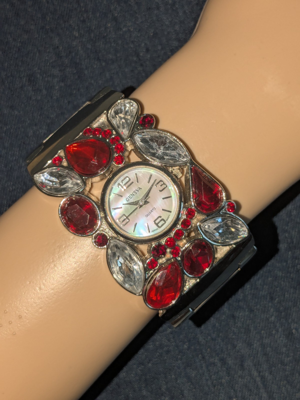 Geneva Women’s Silvertone Watch with Red & Clear Stones & Mother-of-Pearl Dial