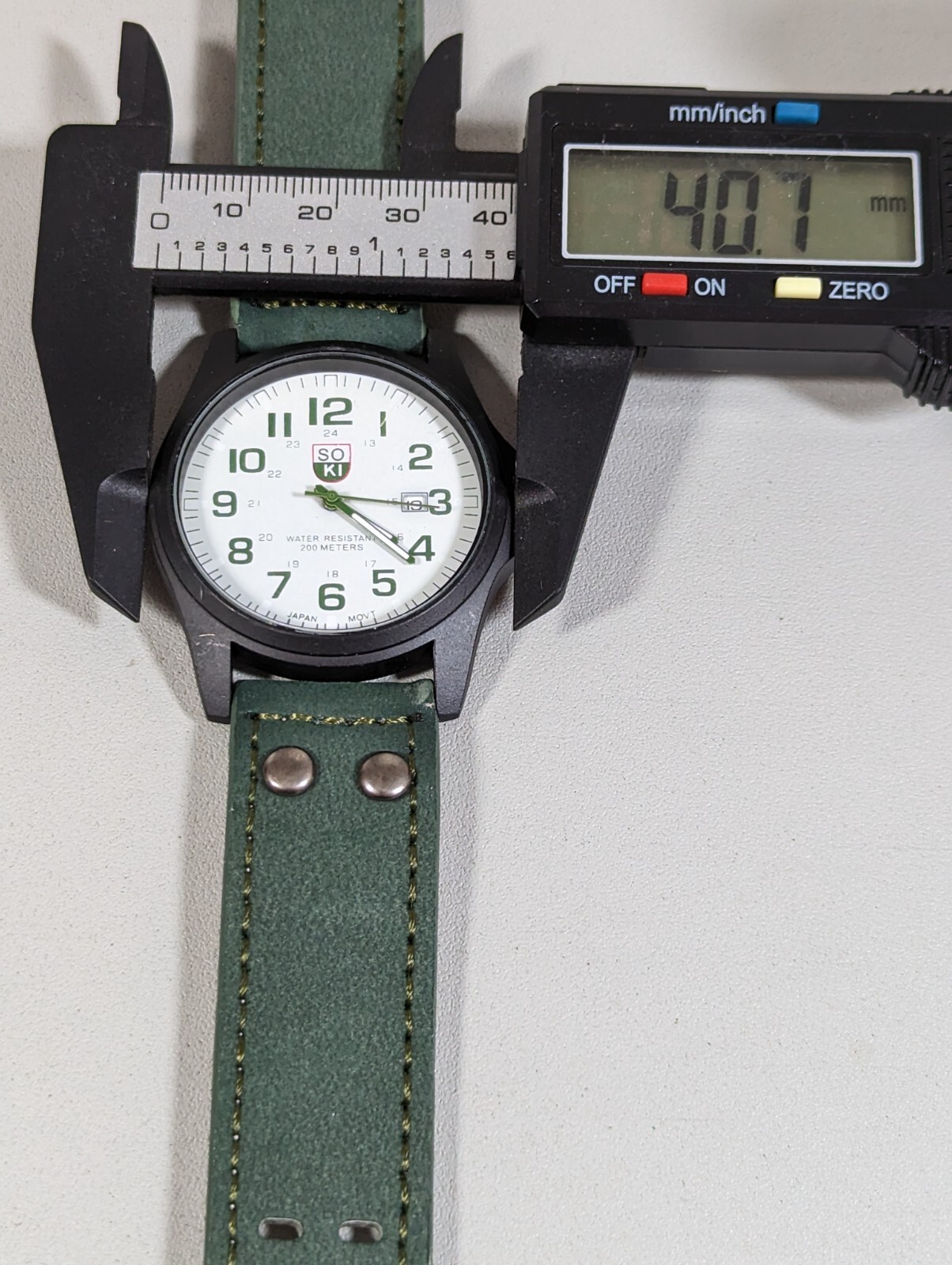 Soki White Dial Date Indicator Black Round Case Green Faux Leather Band Watch