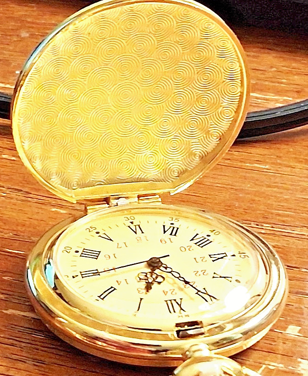 Gold tone comememorative pocket watch titled Anniversary We the People
