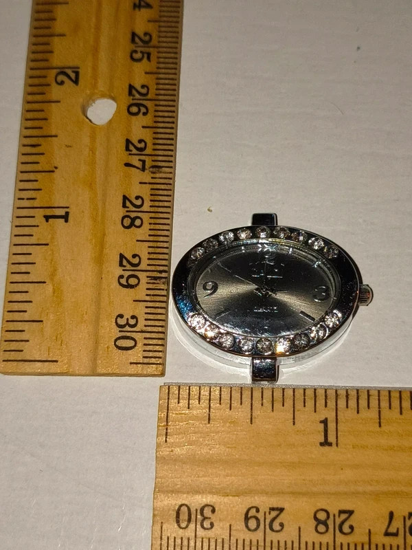 Silver-tone quartz watch face with rhinestones