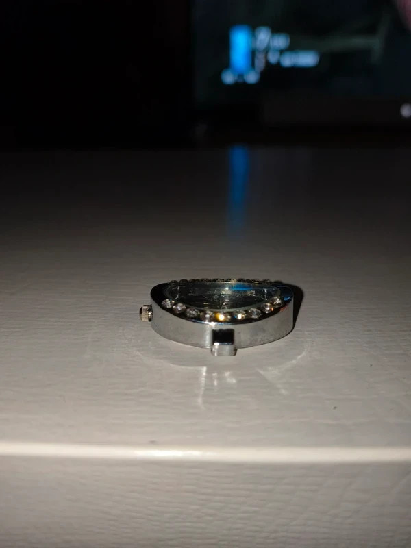 Silver-tone quartz watch face with rhinestones