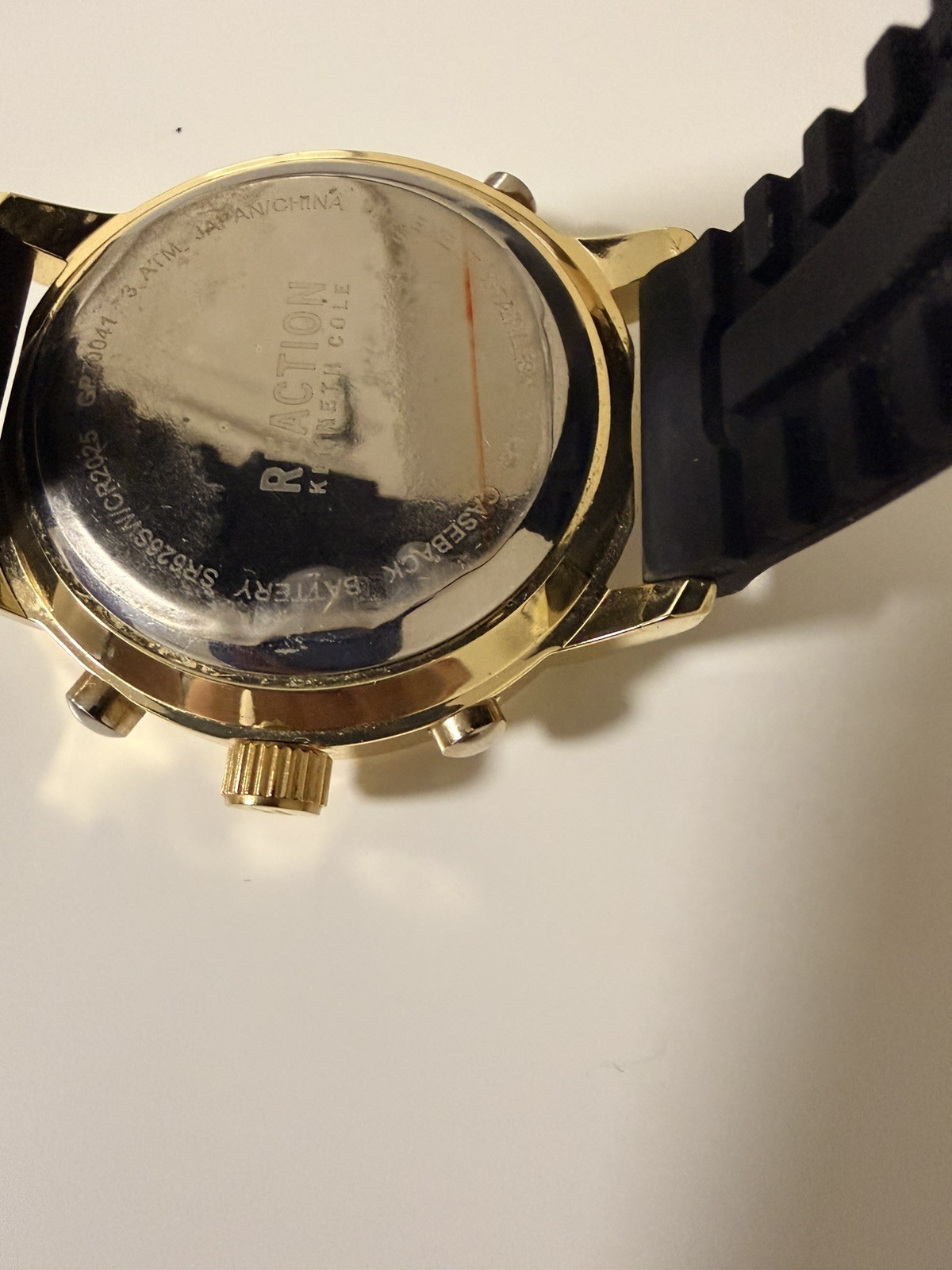 Kenneth Cole Reaction watch for menGold with black Silicone Band