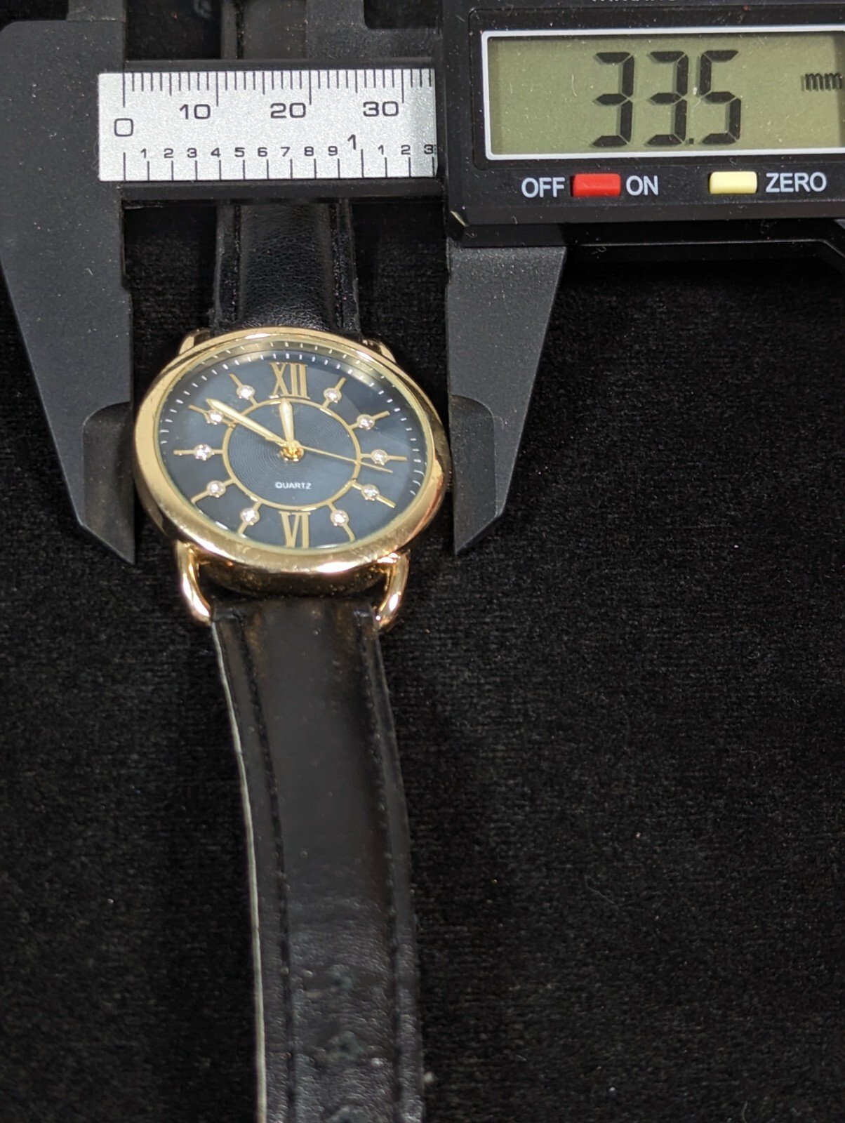 Womans Blue Gray Pearlized Dial Gold Tone Case Black Band Watch 7.5 Inch
