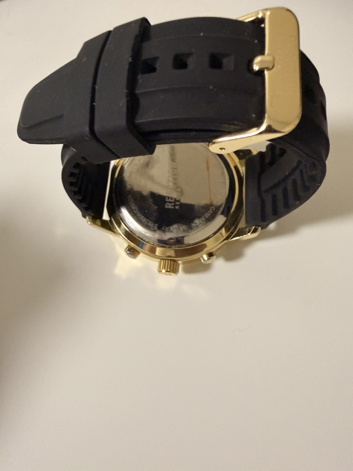 Kenneth Cole Reaction watch for menGold with black Silicone Band
