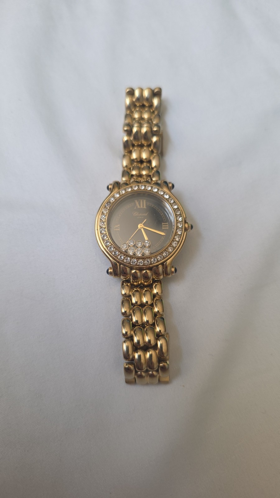 Gold Chopard Geneve black face happy sport watch