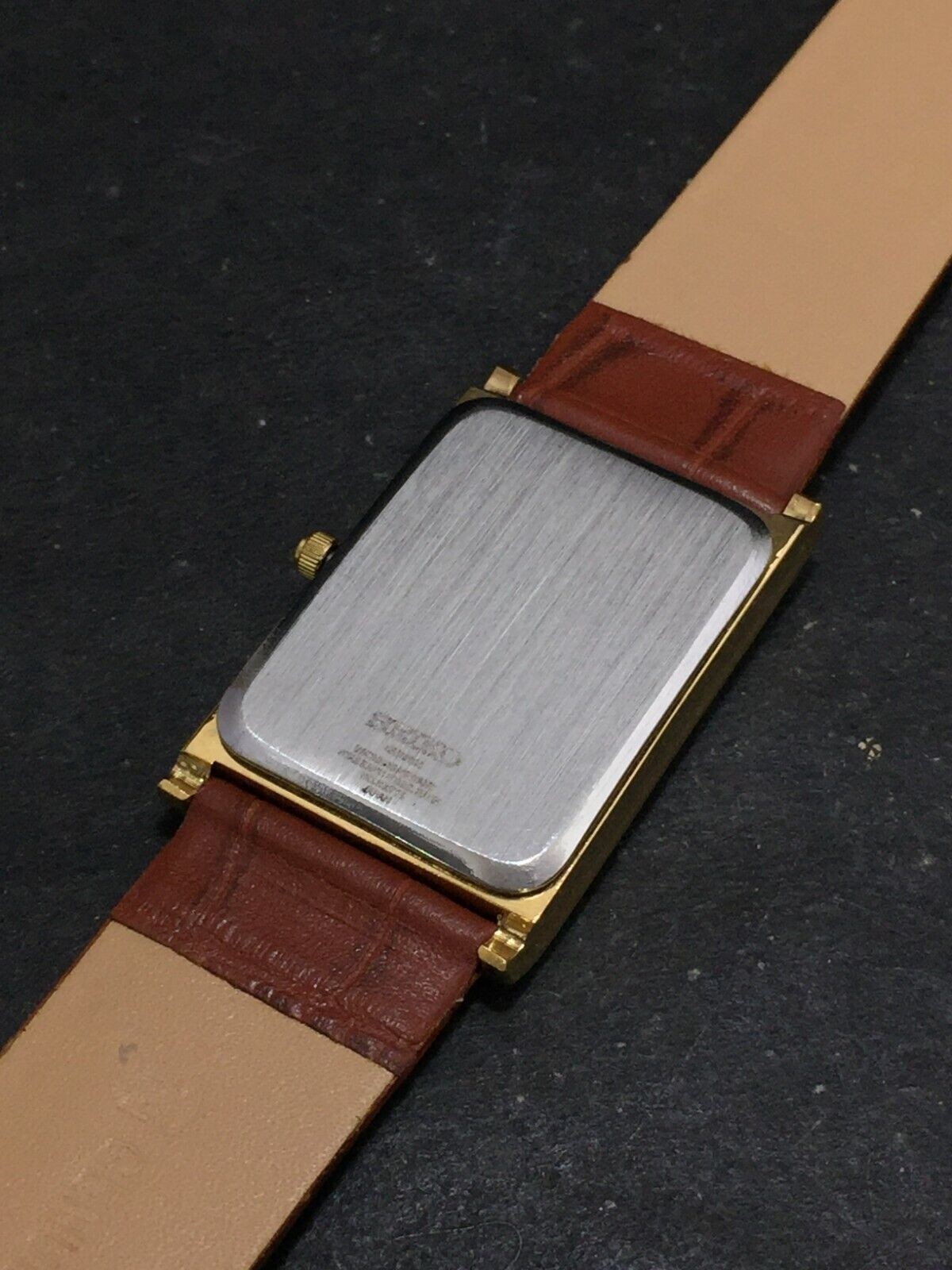 Vintage Seiko Slim Quartz Red Face Rectangle Japanese 26MM Case Mens Watch S06