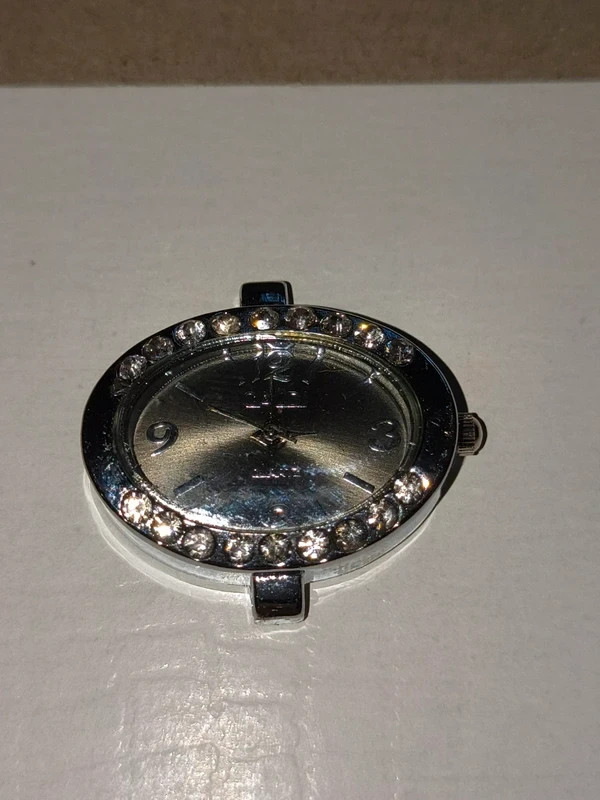 Silver-tone quartz watch face with rhinestones