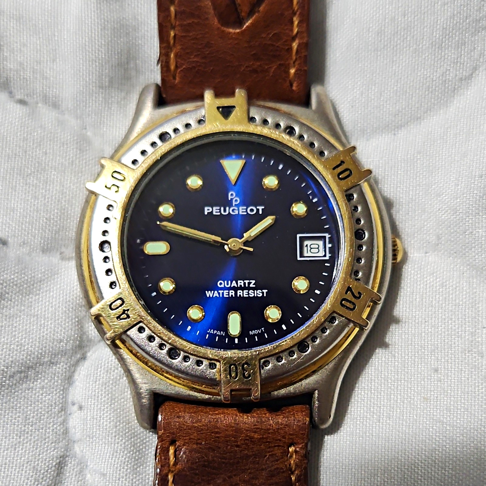 Peugeot Quartz Rotating Bezel Blue Dial Date NEW BATTERY