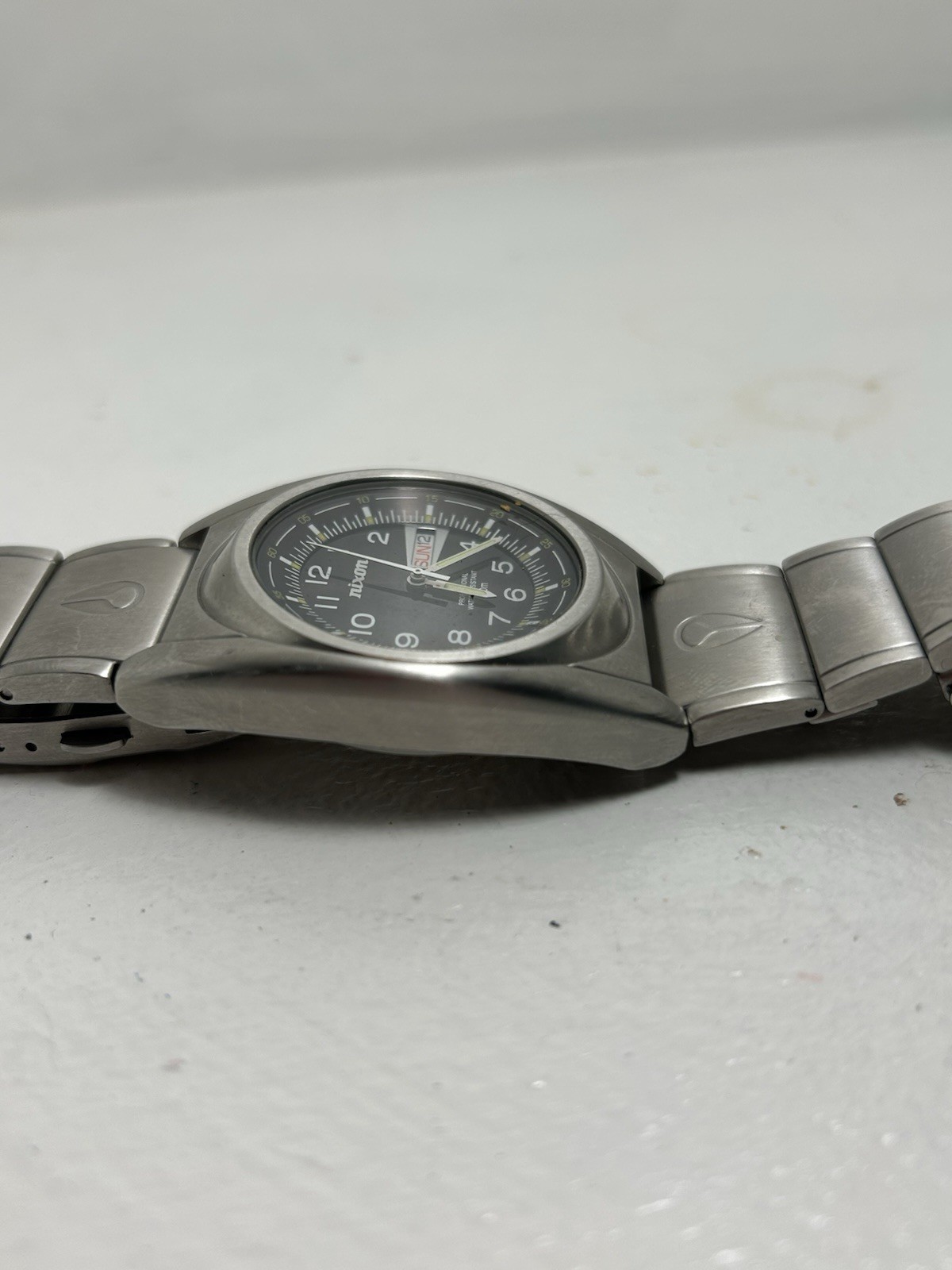 Nixon Quartz Wristwatch Black Dial Day/Date 100m Silver Stainless Bracelet