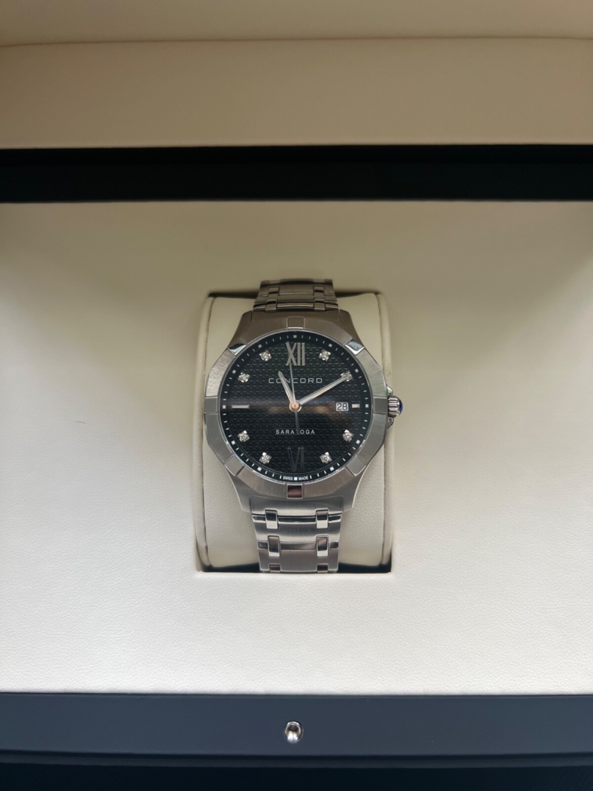 Concord Saratoga Men’s Diamond Pattern Black Bezel 40 mm watch.