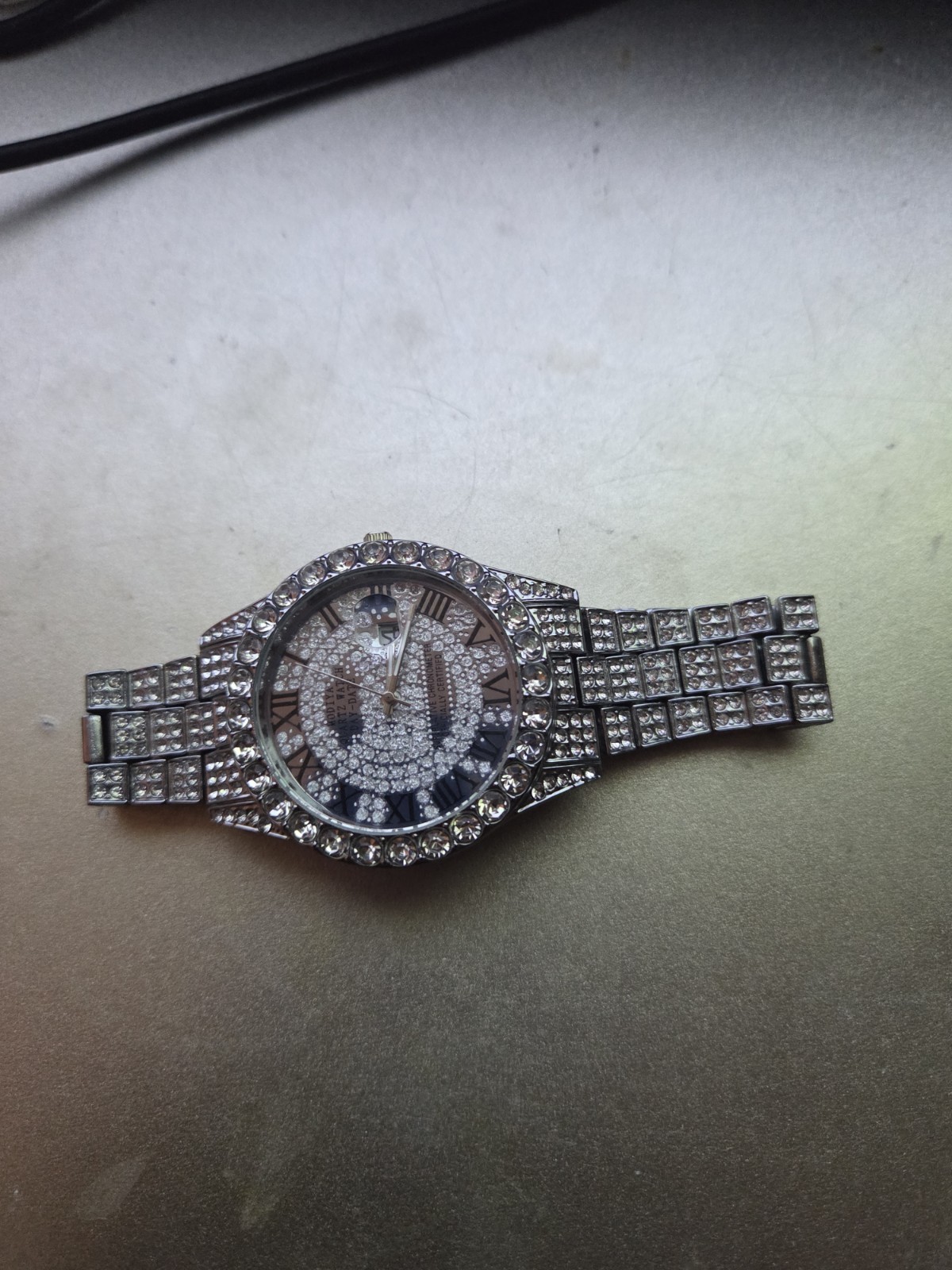 Iced-Out Silver Tone Analog Wristwatch Roman Numerals Gem-Set Bezel Rhinestone