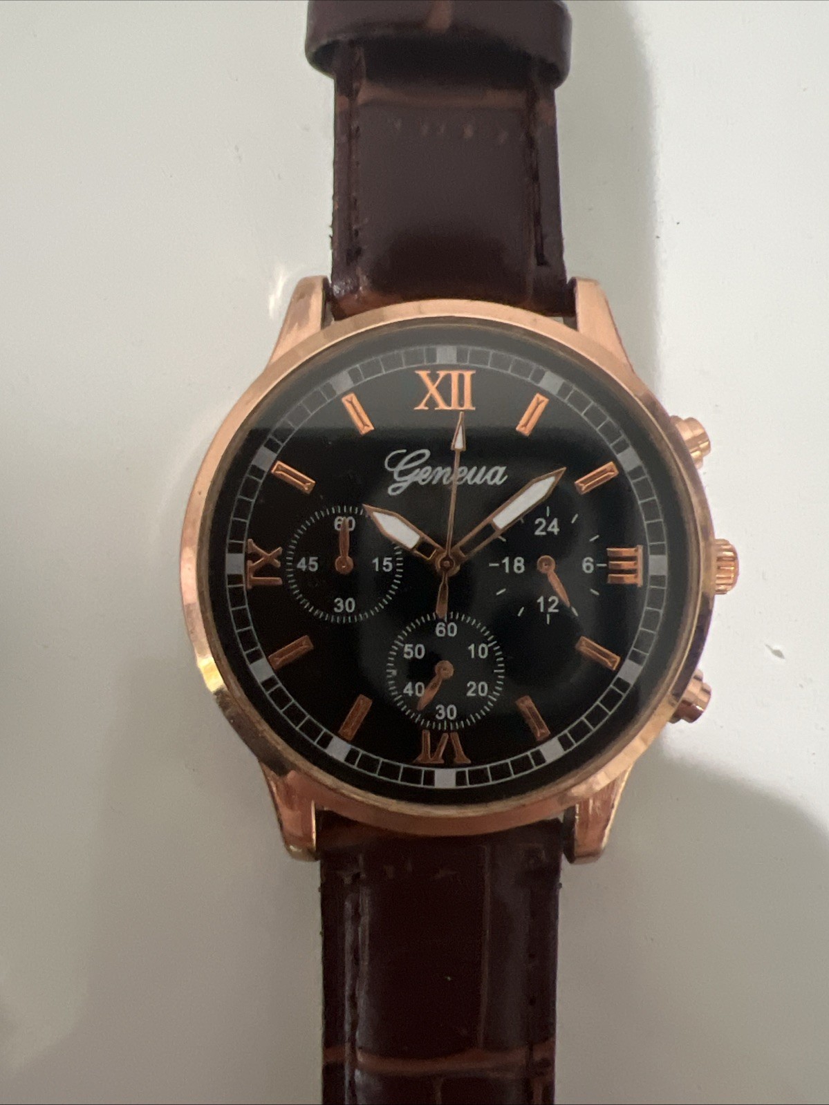 Two Men’s wristwatches. Blue Migeer W Black Band. Black And Rose Gold Geneva