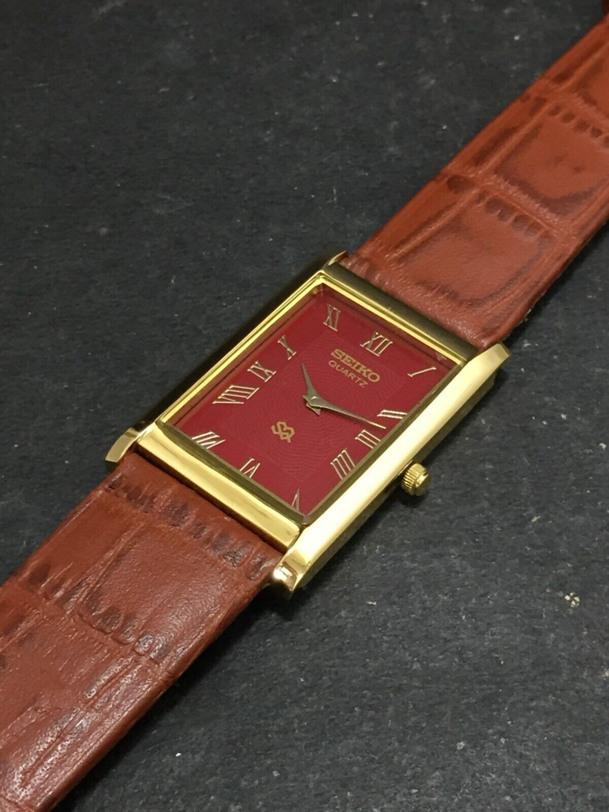 Vintage Seiko Slim Quartz Red Face Rectangle Japanese 26MM Case Mens Watch S06