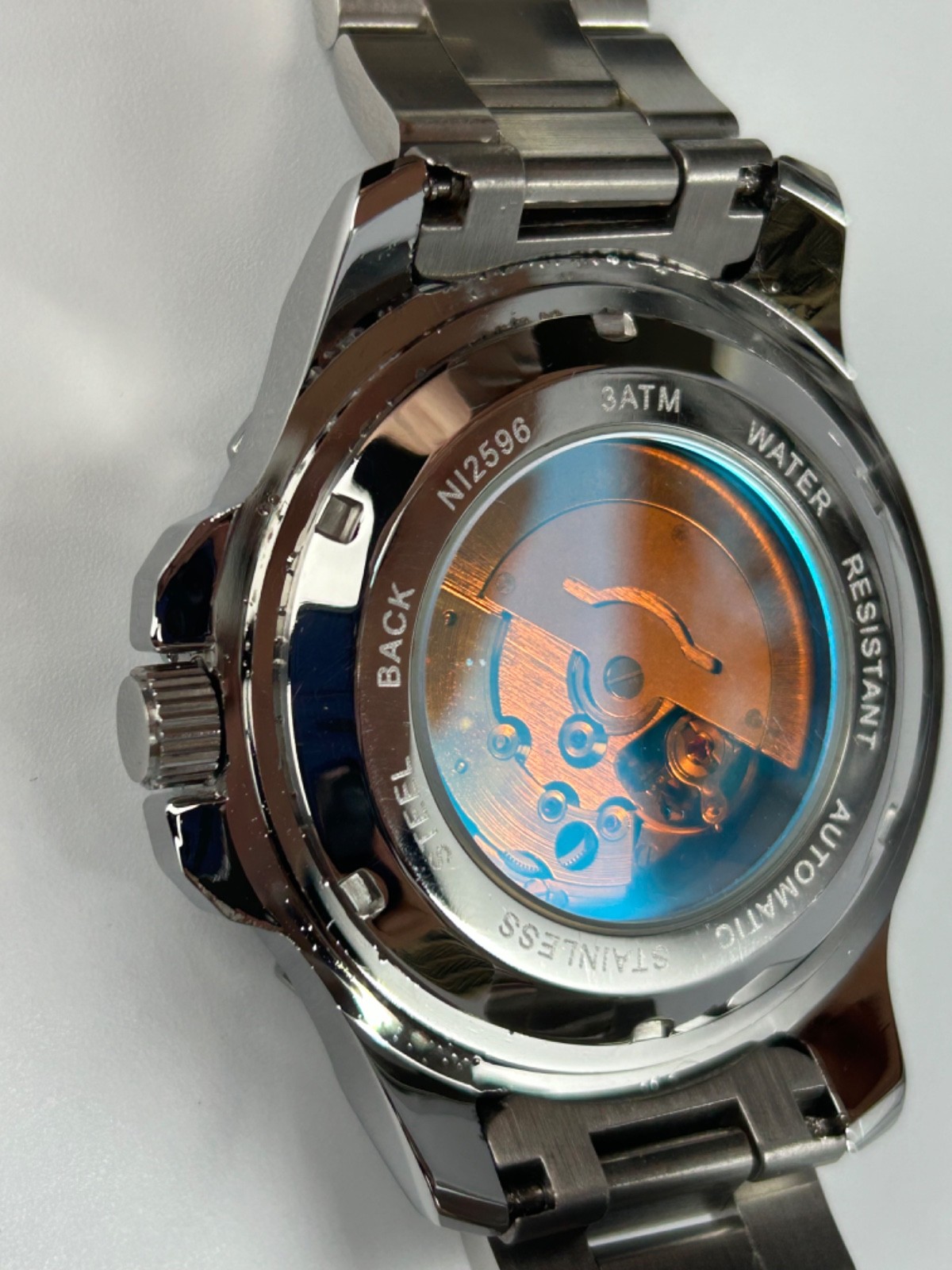 Nibosi NI2596 Mens Automatic 42MM Day/Date Silver Tone Blue Dial Exhibition Back