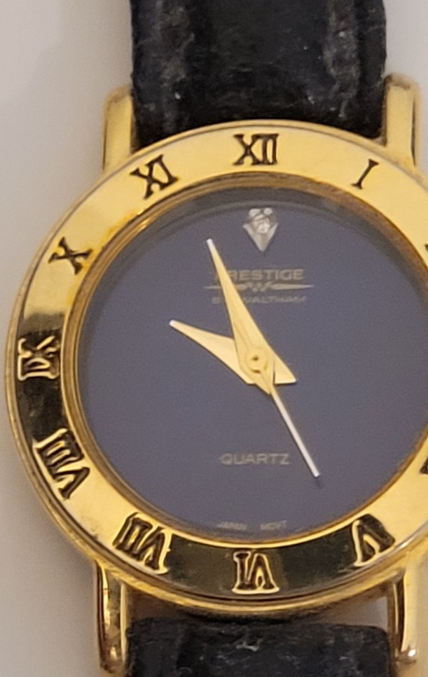 PRESTIGE by WALTHAM QUARTZ WATCH. DIAMOND DIAL WITH GOLD TONE