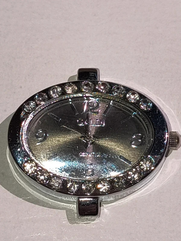 Silver-tone quartz watch face with rhinestones