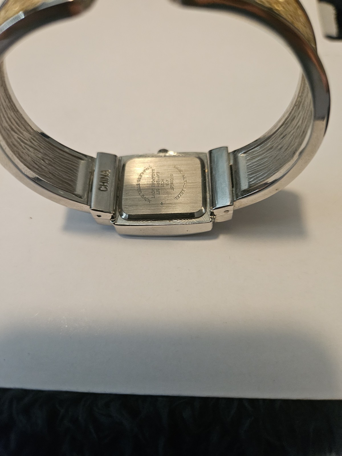 Studio Time Quartz Watch Featuring Rectangular Case and Gold-Tone Handcuff Band