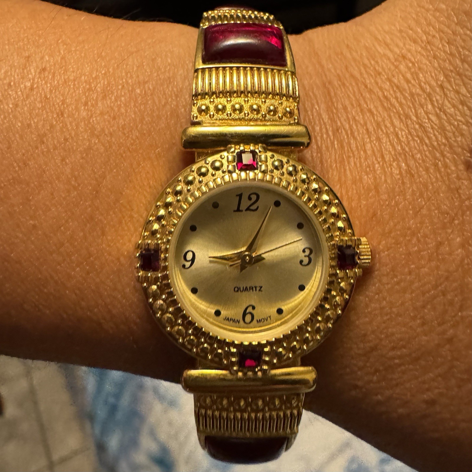 Vintage Avon Womens Watch Gold Tone Red Cabochon Jewel Accents Japan Quartz 24mm